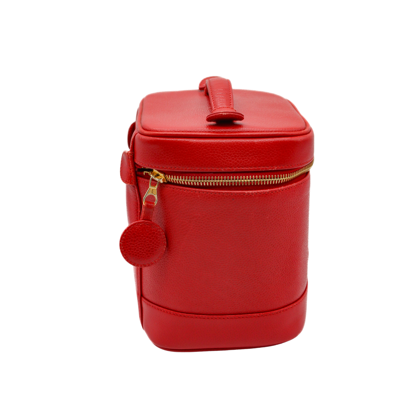Red leather suitcase with gold zipper on a white background