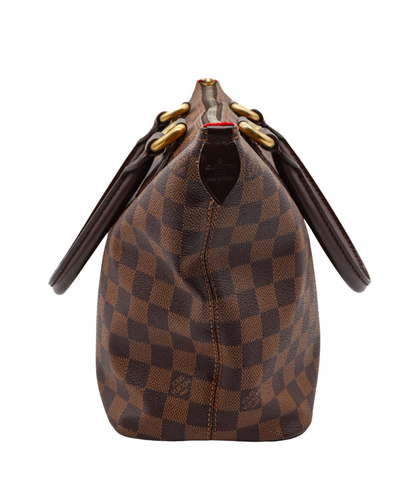 Brown Louis Vuitton checkered handbag with gold accents on a white background