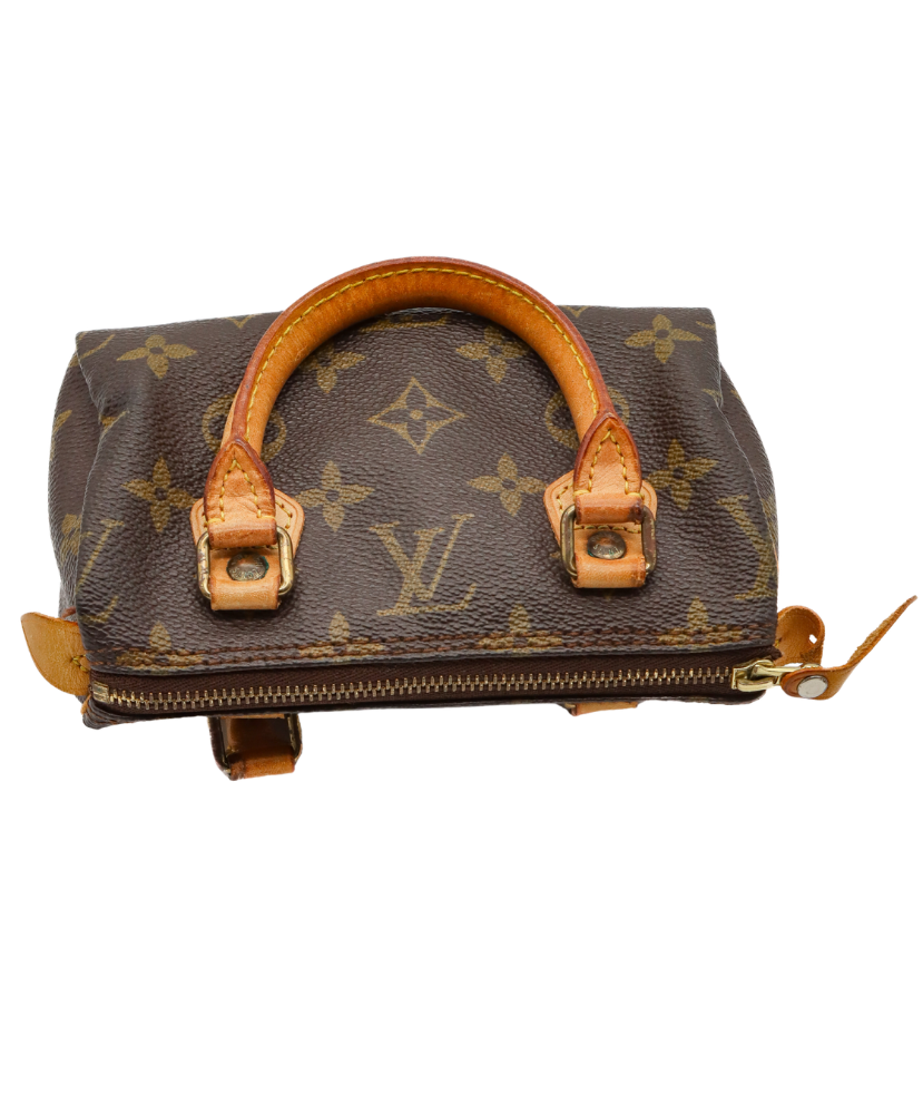 Louis Vuitton monogram handbag with brown handles on a white background