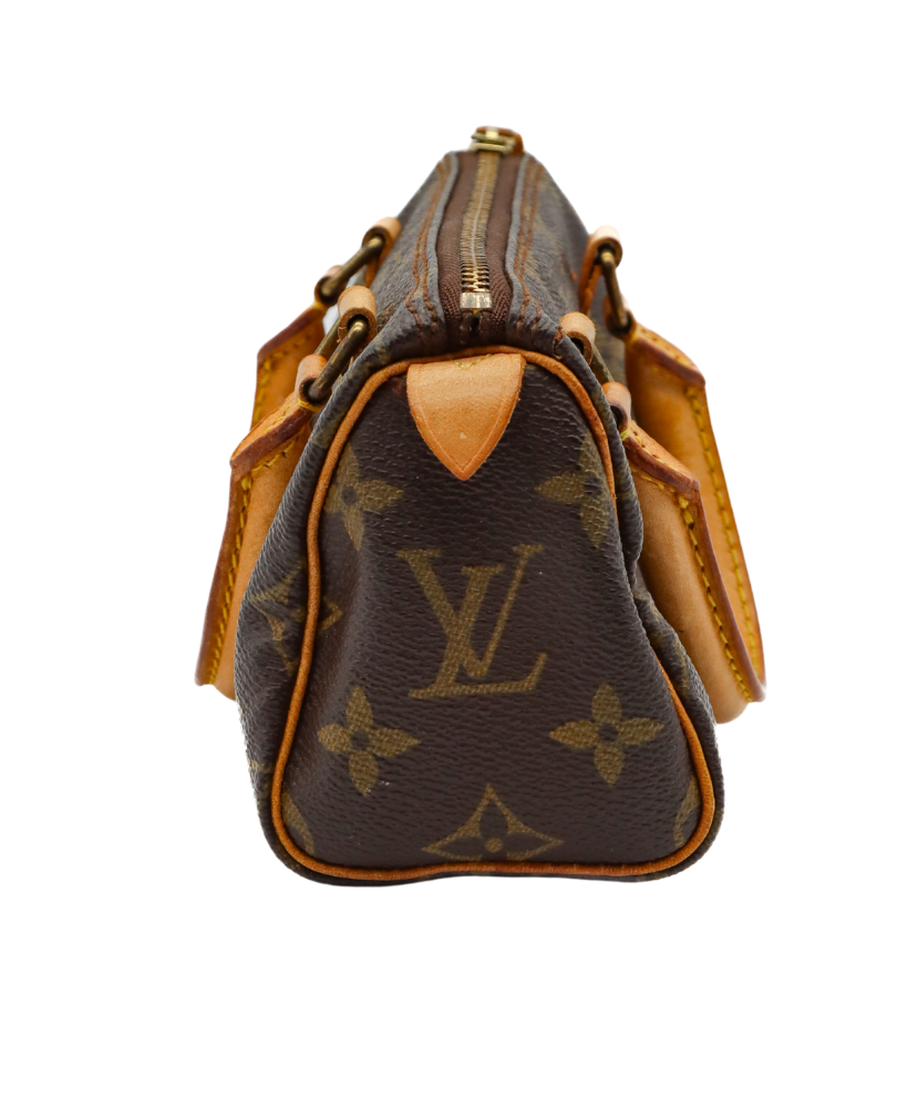 Louis Vuitton monogram handbag with brown handles on a white background