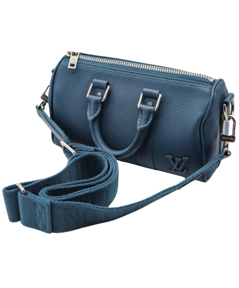 Blue handbag with a strap on a white background