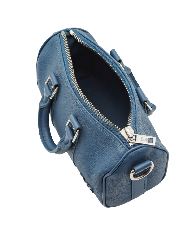 Blue Louis Vuitton luggage bag with silver buckles on a white background