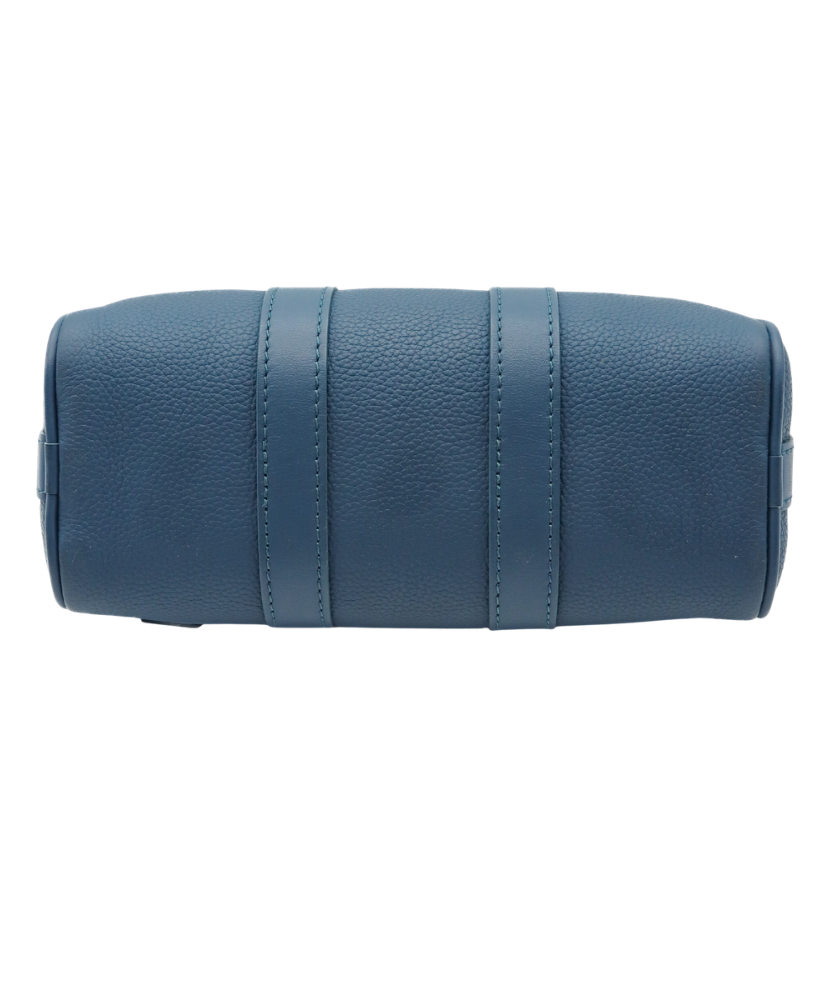 Blue Louis Vuitton luggage bag with silver buckles on a white background