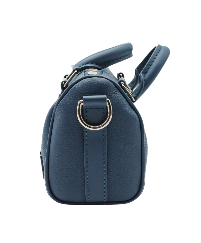 Blue Louis Vuitton luggage bag with silver buckles on a white background