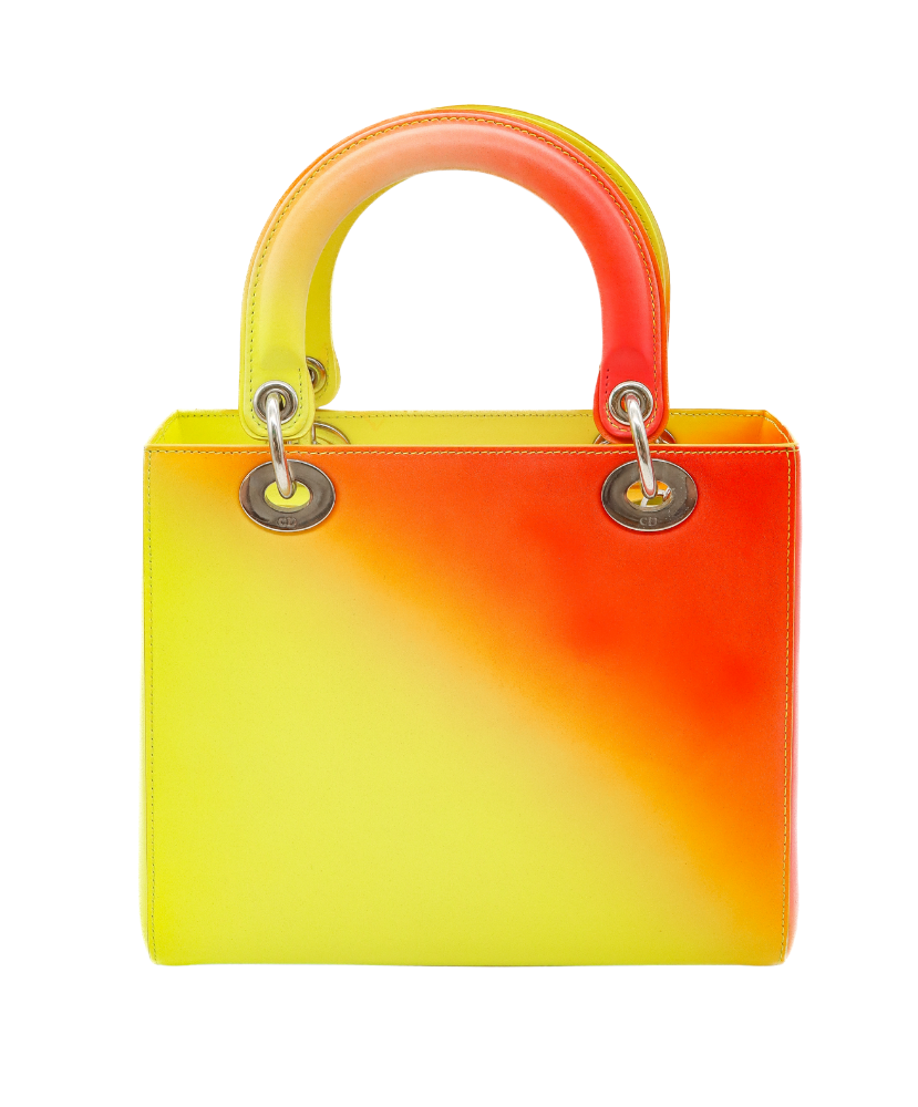 Gradient yellow to Red Dior handbag with a visible brand logo on a white background