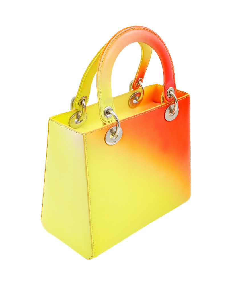 Gradient yellow to Red Dior handbag with a visible brand logo on a white background