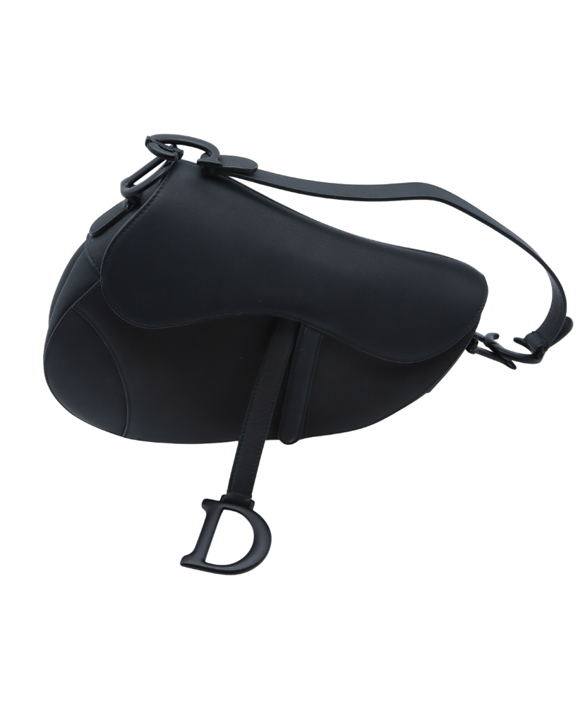 Black Dior saddle-shaped bag with a visible brand logo on a white background