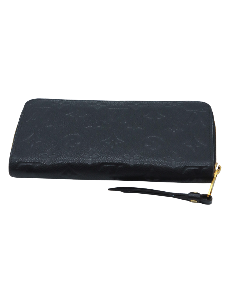 Black Louis Vuitton wallet with gold zipper on a white background