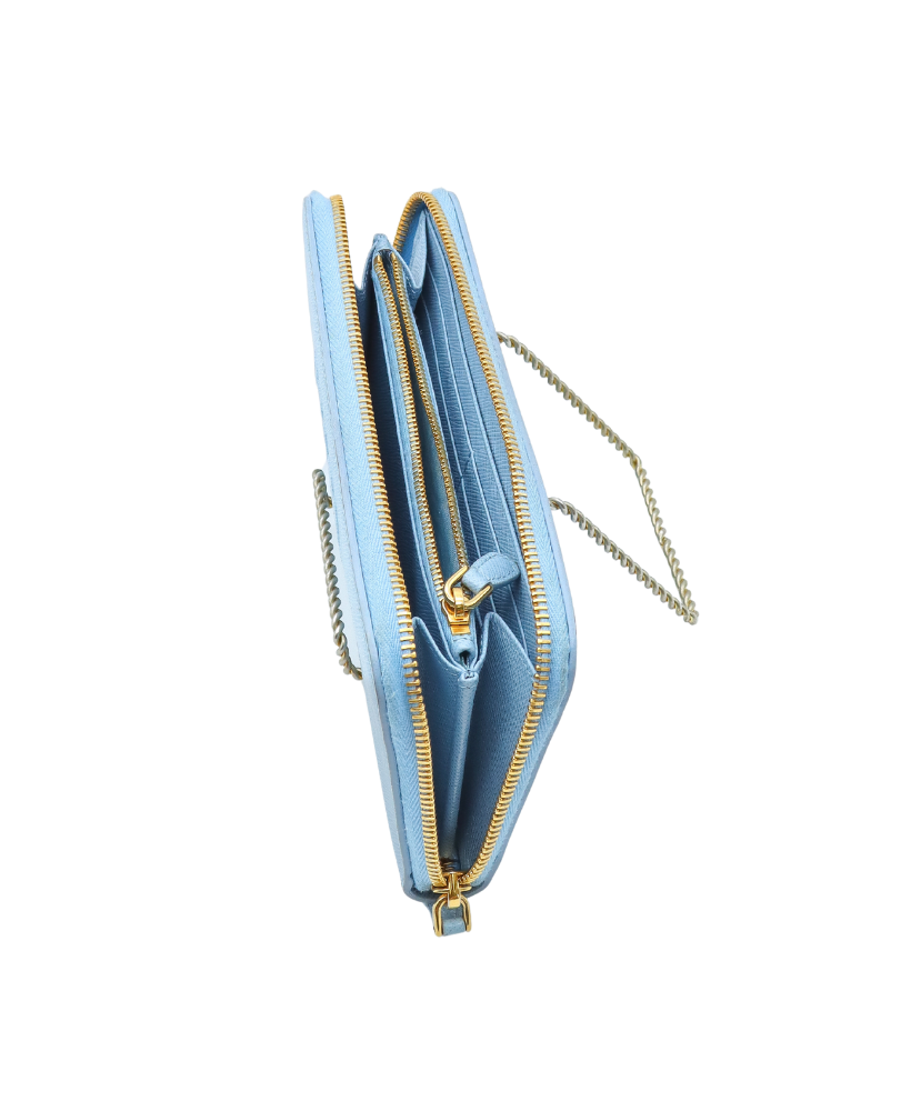 Light blue Prada clutch bag with gold zipper and chain detail on a white background