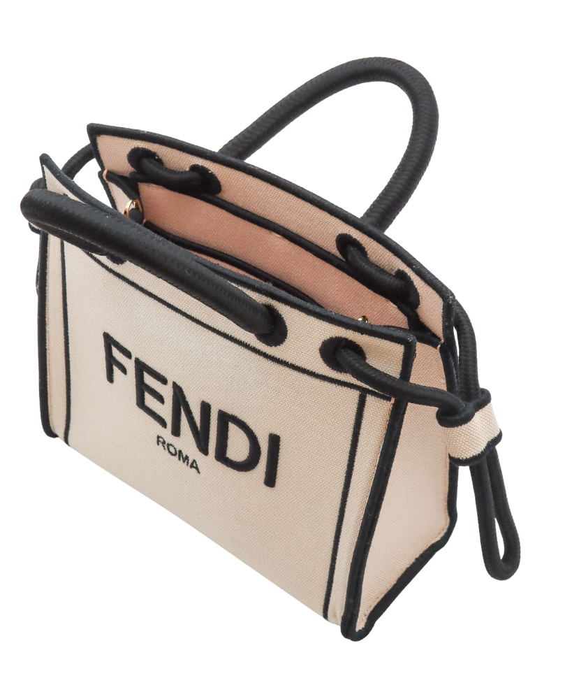 Fendi handbag with beige body and black handles and trim on a white background
