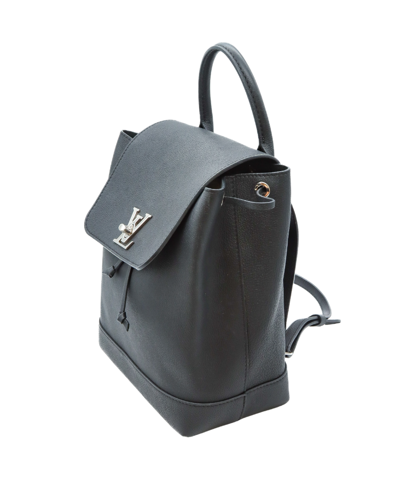 Black Louis Vuitton backpack with a gold logo on a white background