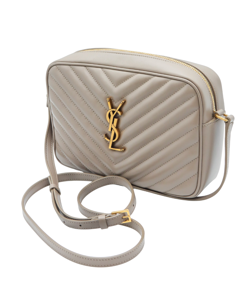 Beige Saint Laurent handbag with a gold logo on a white background