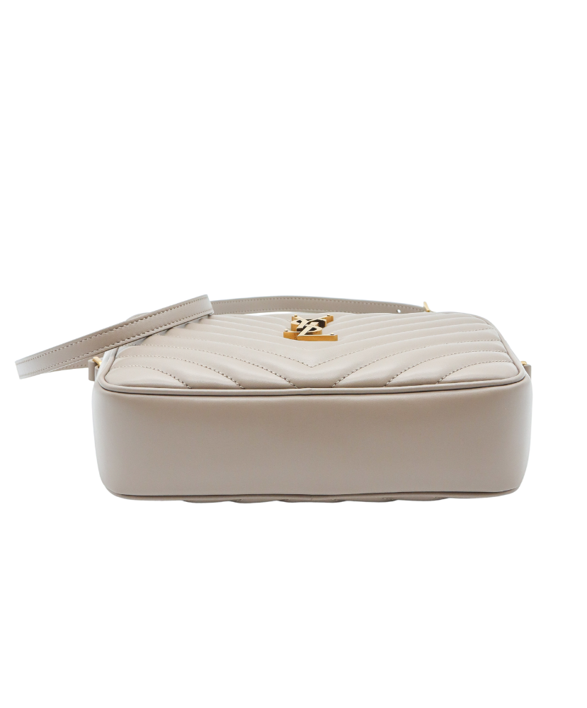 Beige Saint Laurent handbag with a gold logo on a white background