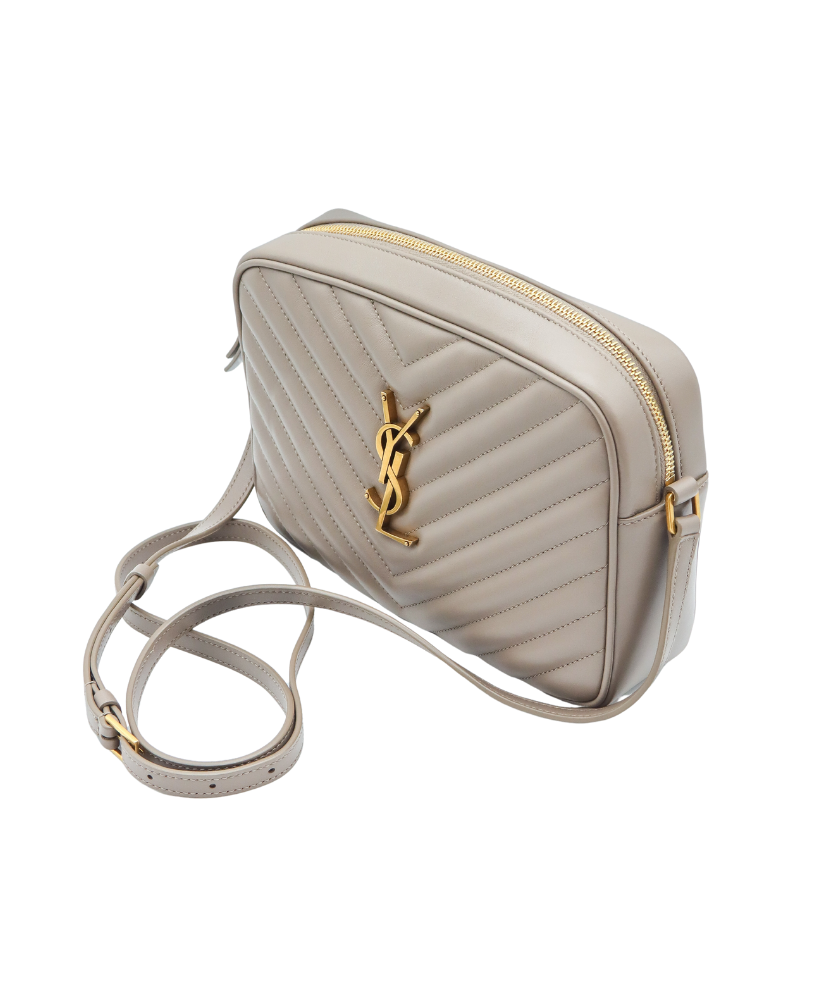 Beige Saint Laurent handbag with gold accents on a white background