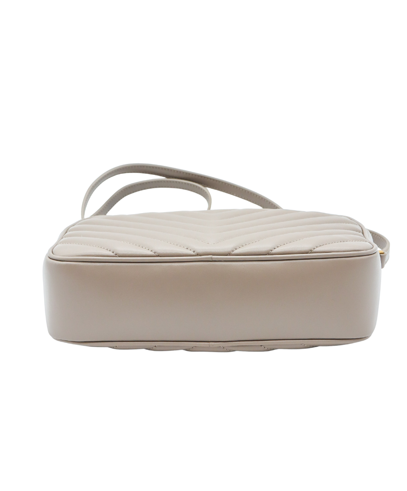 Beige Saint Laurent handbag with gold logo on a white background