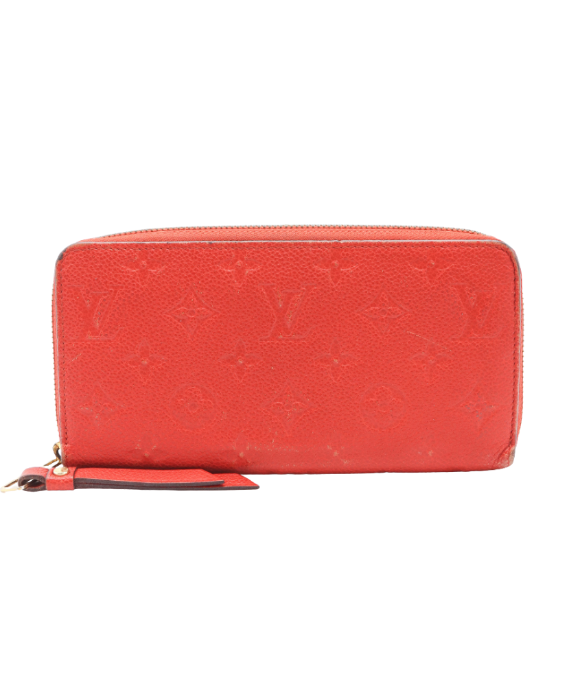 Red Loius Vuitton wallet with brand logo on a white background