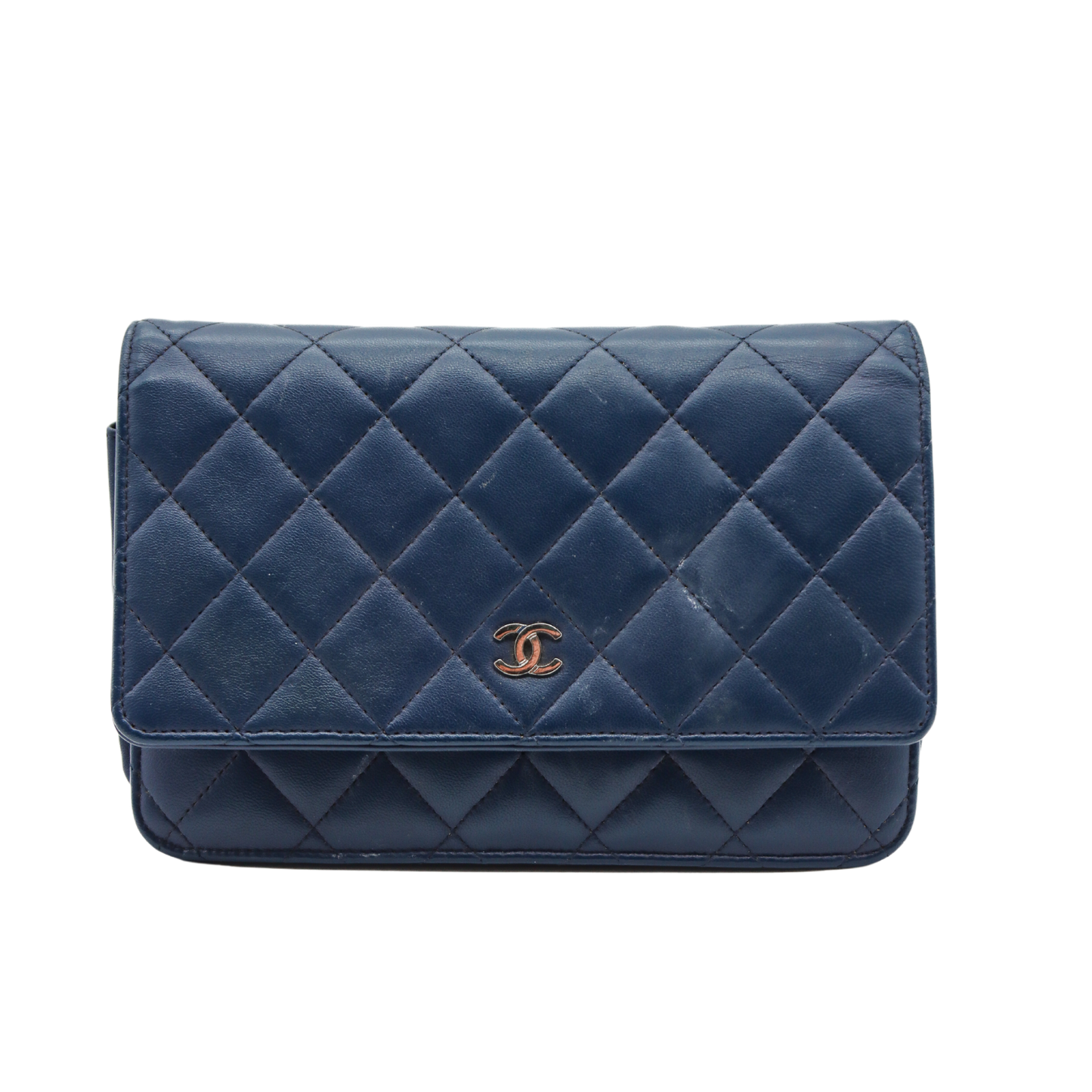 Blue Chanel quilted handbag with Chanel logo on a white background